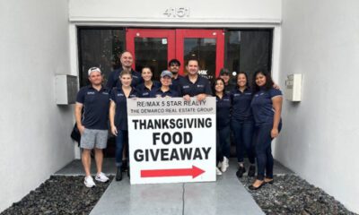 The DeMarco Real Estate Group of RE/MAX 5 Star Realty distributes Thanksgiving meals to families in need